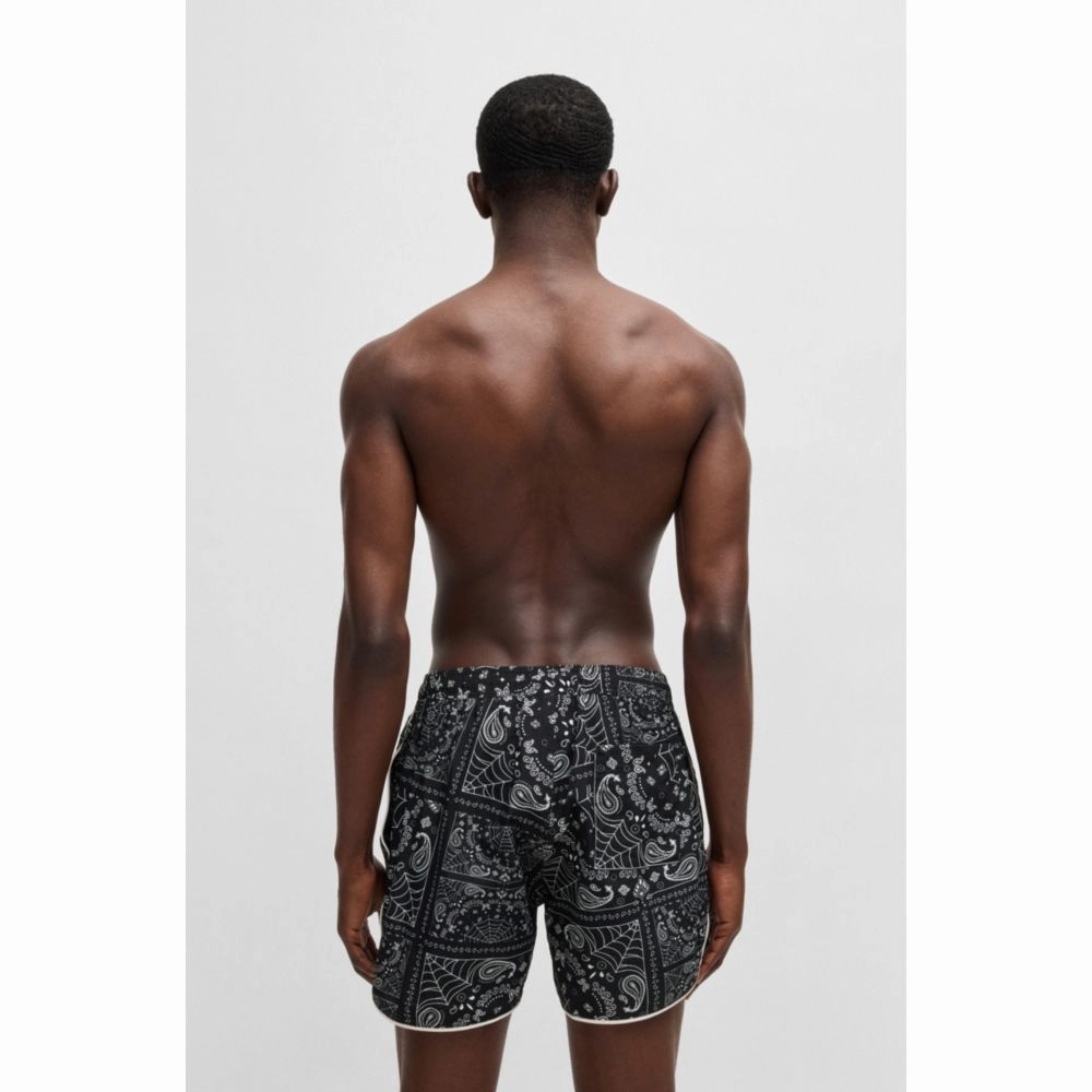 Seasonal-print swim shorts with round hem